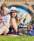 Couple enjoying picnic with Colorful Starfish Beach Lunch Box Insulated Tote With Side Pocket, outdoors on grass