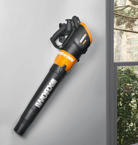 Leaf blower attached to a wall, mounted with Heavy Duty Wall Mount Tool Holder for Garage and Workshop Holds Your Tools Securely Up To 33 Pounds