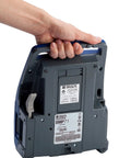 Hand holding the Straight Up Heavy Duty Desktop And Portable Label Printer With Quick Charge USB for easy transport.