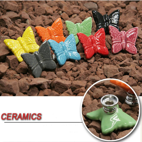 Colorful ceramic butterfly cabinet knobs on rocks, includes Ceramic Butterfly Cabinet Knobs Set Pink, 6 Pack Vintage Drawer Pulls.