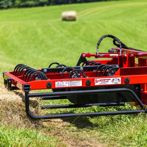 Heavy Duty 9 Inch Hay Grapple Replacement Hook Pack attached to a hay accumulator on a green field, ready for moving bales.