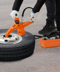 Person using Hydraulic Bead Breaker With 10000 PSI Power And Metal Foot Pump Heavy Duty Steel Bead Breaker Tool on tractor tire
