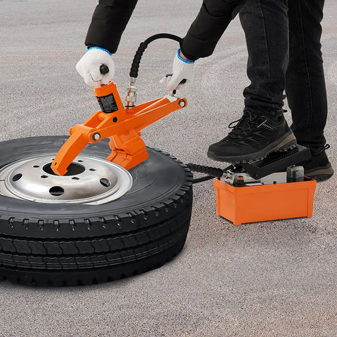 Person using Hydraulic Bead Breaker With 10000 PSI Power And Metal Foot Pump Heavy Duty Steel Bead Breaker Tool on tractor tire