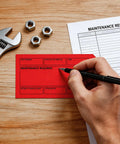 Straight-Up Red Out Of Service Tags With Galvanized Wire Ties, 200 Pack Heavy Duty Laminated Repair Required Lockout Signs For OSHA Wall Mounting Industrial Machine And Valve Inspection Safety Gear on a wooden table.