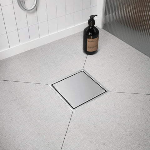 6 Inch Square Shower Drain With Flush Mount Tile Grate And Heavy Duty Hair Catcher Fast Flow Brushed Nickel Stainless Steel Rust Free Floor Drain installed in grey shower floor