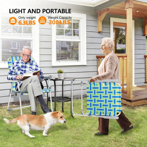 Elderly woman carrying Oversized Folding Aluminum Beach Chair Set With Webbed Seat And Detachable Cup Holder, 300 lb capacity