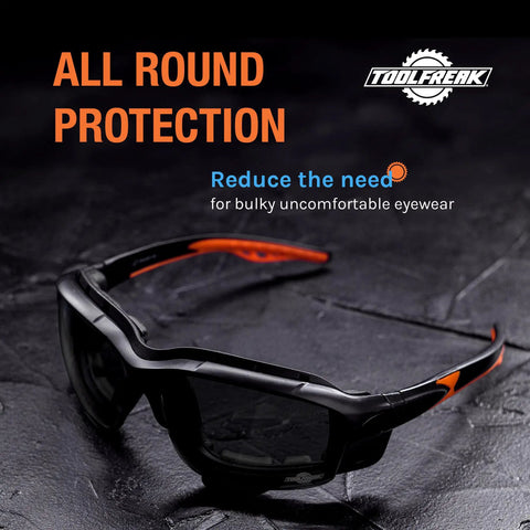 Spoggles All-In-One Protective Eyewear With Foam Padding, smoke lens, on textured surface, showing hybrid safety glasses design