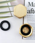 Two Pack Half Inch Brass Blanking Caps With Gasket, Female Thread Nut Caps For Plumbing Fittings And Valves on table, top view