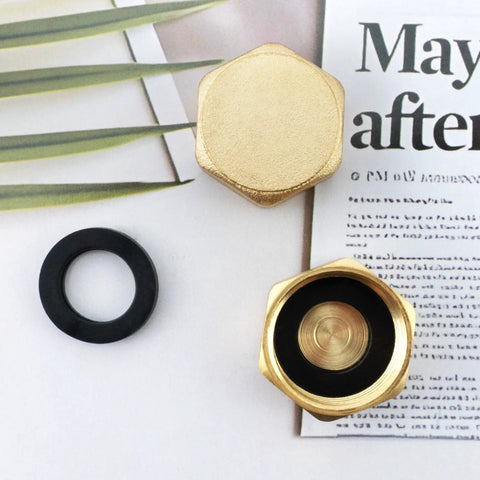 Two Pack Half Inch Brass Blanking Caps With Gasket, Female Thread Nut Caps For Plumbing Fittings And Valves on table, top view