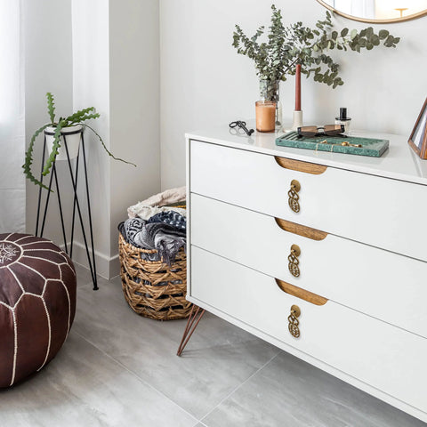 Wealth And Longevity Brass Cabinet And Furniture Pulls Set Of 2 in 2 inches wide on white drawer in interior setting.