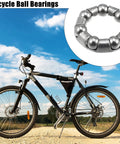 Seven Ball Bearing Cage Retainer For Bike Crank And Wheel Bearings, 20mm Outer Diameter, 13mm Inner Diameter, 4.76mm Ball Size, Stainless Steel, 7 Ball Set, Durable Bike Part displayed next to bicycle