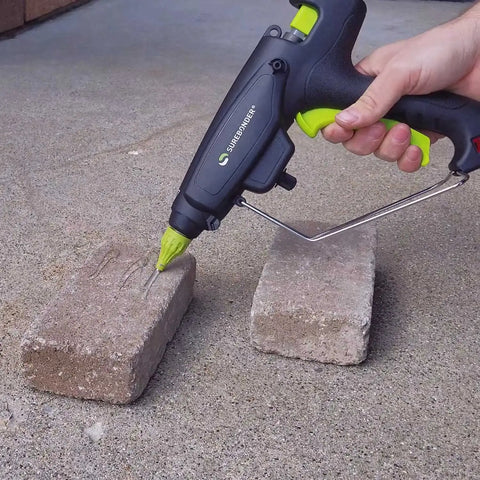 Construction Grade Adhesive Hot Melt Glue Sticks For Tough Jobs used on concrete bricks with full-size glue gun.