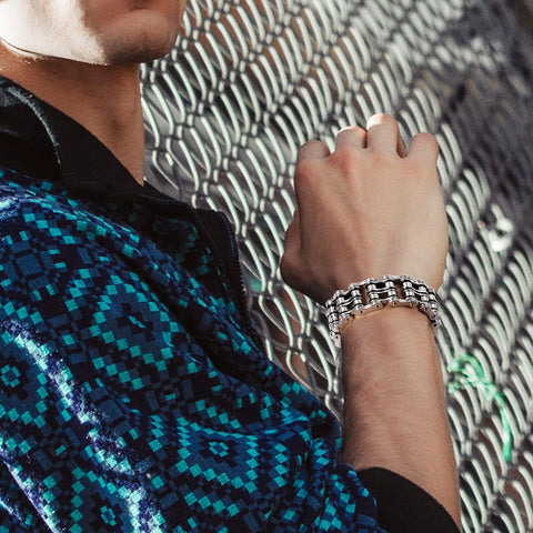 Model wearing Men's 316L Stainless Steel Chain Bracelet In Silver Black Finish For Gearheads And Riders, close-up view