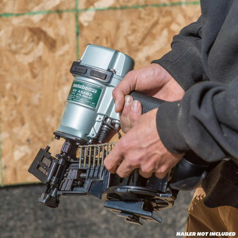 Person holding nailer with shank visible, using One And A Quarter Inch Pneumatic Roofing Nails 7,200 Count Electro Galvanized