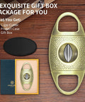 V Cut Cigar Cutter With Zinc Alloy Blade And Stainless Steel Guillotine in gold, gift box and case included, shown on wood surface