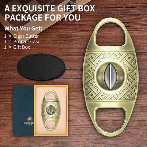 V Cut Cigar Cutter With Zinc Alloy Blade And Stainless Steel Guillotine in gold, gift box and case included, shown on wood surface