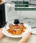 2 In 1 Glass Microwave Splatter Cover And Plate Mat Set With Easy Grip Silicone Handle in use, covering pasta dish