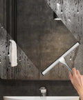 Stainless steel shower squeegee with 10-inch blade and two adhesive hooks for glass doors, silver.