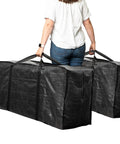 Person carrying XXL 68.5 Gallon Heavy Duty Storage Bags Two Pack With Mega Strong Wrap Around Handles Zippered Reusable Moving Totes