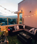 Outdoor String Lights 50ft Connectable Patio Lighting With 52 G40 LED Bulbs Warm White 2200K on balcony at sunset