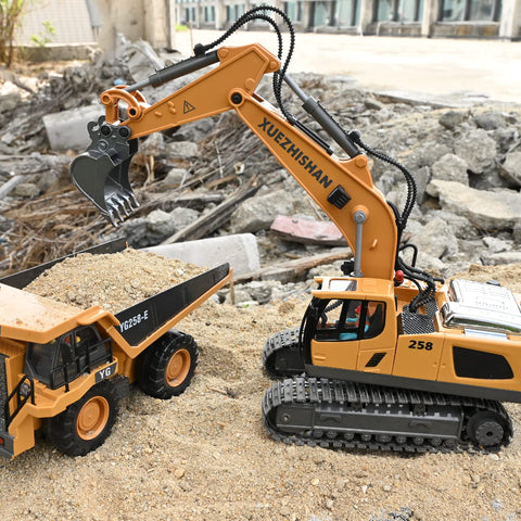 Toy construction set with two vehicles: orange XUEZHISHAN excavator on tracks with bucket and yellow dump truck.