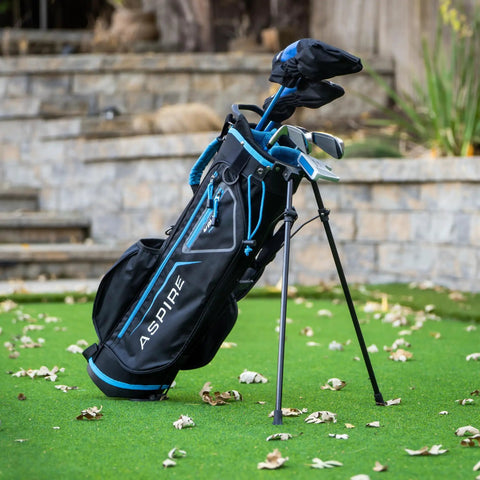 X-Lite Junior Golf Club Set For Kids Right Handed With Driver Hybrid 7 Iron Putter Stand Bag And Headcovers In Blue On Grass