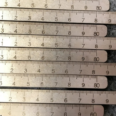 Positioning Calipers For Accurate Cuts And Easy Wood Cutting, adjustable stainless steel measuring tool with precise markings close-up