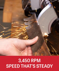 Eight Inch Bench Grinder With Integrated Led Work Lights And Built In Coolant Tray powered, sharpening a blade at 3450 RPM with sparks.