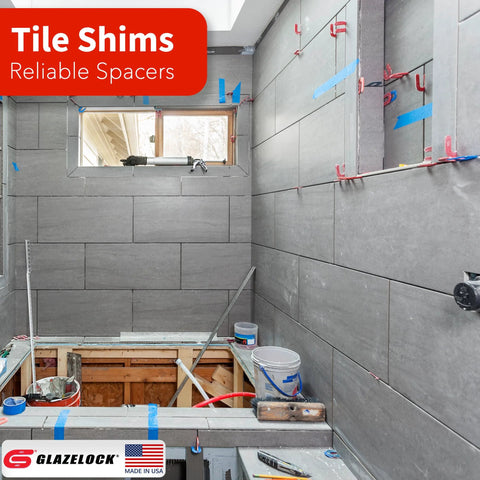 Glazelock plastic tile shims multipack for leveling tiles in bathroom tiling; gray tile walls; Glazelock brand