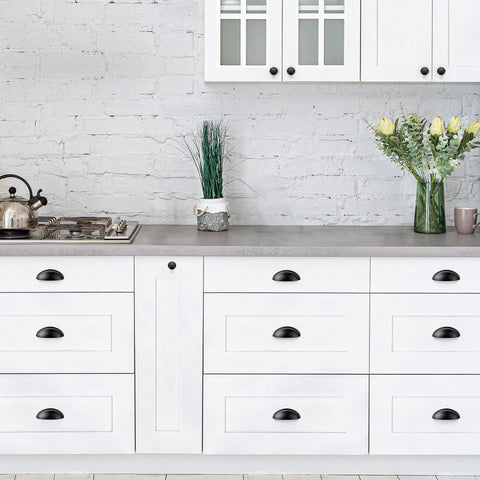 Three Inch Cup Drawer Pulls Set Of Five In Flat Black Modern Kitchen Cabinet Handles Hardware with smooth scratch-resistant finish on white cupboards.