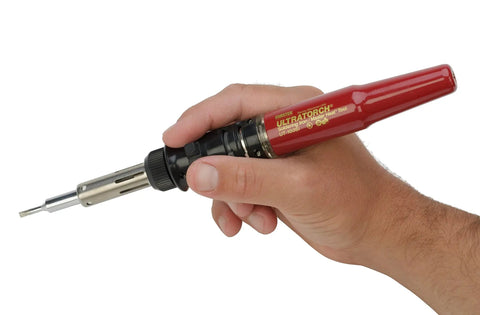 Hand holding Ultratorch UT-50 Pen Sized Butane Powered 3 In 1 Heat Tool Soldering Iron Flameless Heat Tool And Pinpoint Torch