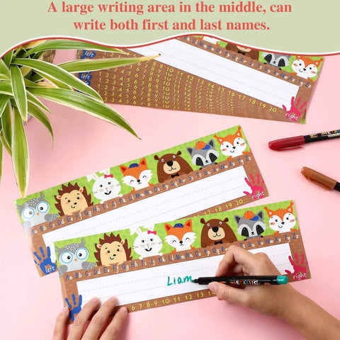 Kid Friendly Desk Labels Pack, 40 Reusable Woodland Themed Name Plates With Alphabet And Numbers, Glue Dots Included shown on a desk.