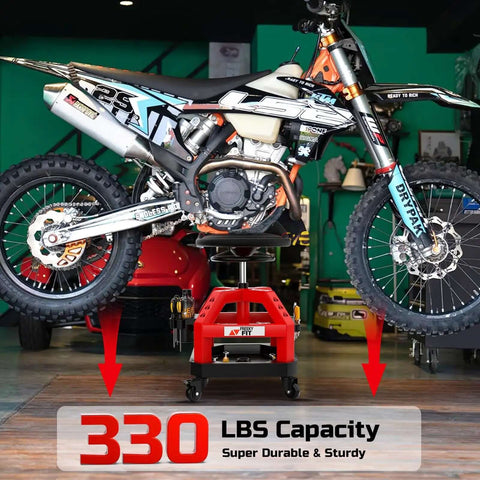 Motorcycle supported by Beefy Heavy Duty Rolling Shop Stool For Garage With Casters Adjustable Height 360 Degree Swivel Seat Tool Tray Storage 330 Lbs Capacity Padded Mechanic Stool Magnetic Tool Hold Red on workshop floor.