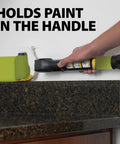 A person uses Smart Edge 3 Inch Mini Paint Roller Kit With No Tray Design to paint clean edges on a countertop.