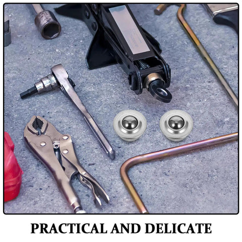 Six Pack Stainless Steel Ball Transfer Units With Omnidirectional Roller Bearings among tools on a workbench
