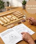 Leonardo Da Vinci Catapult Kit Build a Working Wooden Siege Engine components laid out with instruction manual and build time detail.