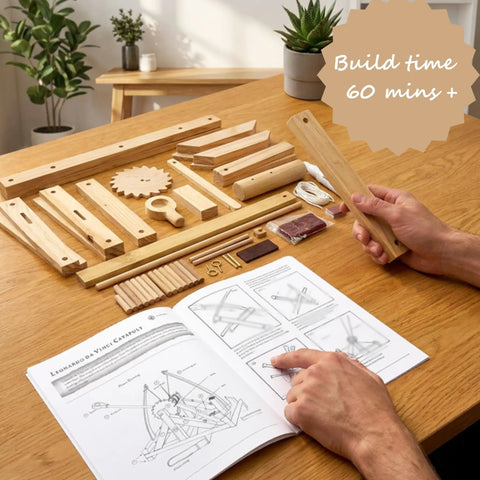 Leonardo Da Vinci Catapult Kit Build a Working Wooden Siege Engine components laid out with instruction manual and build time detail.
