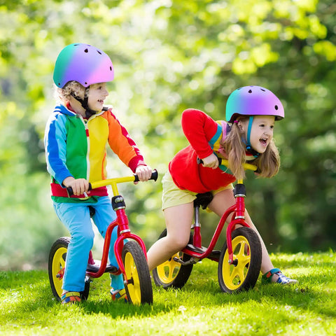 Children riding bikes wearing All Ages Kids Helmet For Boys And Girls Lightweight Ventilated Safety Gear For Bike Scooter Inline Skates