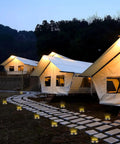 Solar Ground Lights Outdoor 12 Pack With 12 LED Disk Lights line pathway near tents at night