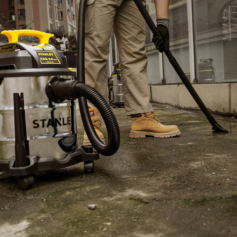 Pro Grade 6 Gallon Wet Dry Vacuum With 4 Peak HP Motor And Stainless Steel Tank In Silver And Yellow used for sidewalk cleanup