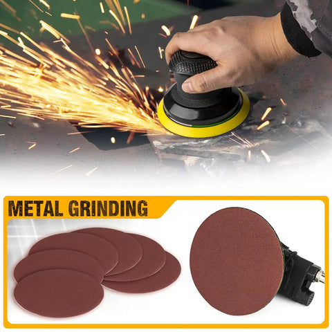 5 Inch Air Random Orbital Sander in use on metal, sparks flying. Extra sanding pads shown below for dual action pneumatic palm sander.