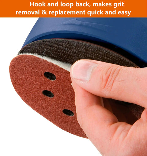 Close-up of 60Pcs 5 Inch 8 Hole Sanding Discs Set With Hook And Loop Backing being attached to random orbital sander