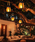 Gen2 Solar Lanterns Outdoor With Ultra Real Flame hanging in garden, creating ambient lighting for patio decor.