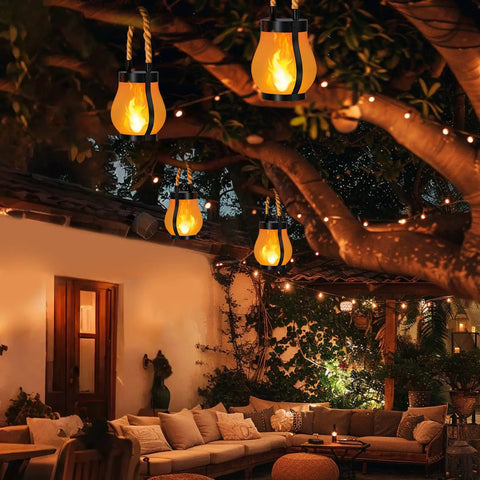 Gen2 Solar Lanterns Outdoor With Ultra Real Flame hanging in garden, creating ambient lighting for patio decor.