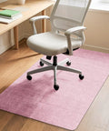 Non Slip Office Chair Mat For Hardwood Floors 48 By 36 Inches Large Pink Floor Protector Thick Heavy Duty Recyclable Gliding Desk Mat shown under a rolling chair on hardwood floor.