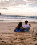 Couple sitting on sand using Go Anywhere Camping Chair With Padded Seat And Backrest Adjustable And Ultra Portable Lightweight Blue