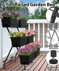 Three Tier Vertical Garden Planter With Six Boxes, 31 Inch Tall Raised Garden Bed on patio with flowers, black metal