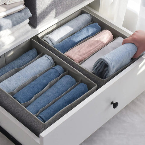 Five Grid Wardrobe Organizer For Folded Clothes And Jeans Stackable Closet Drawer Storage in gray holding jeans in a drawer