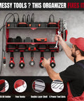 Man organizing tools on All In One Wall Mounted Power Tool Organizer With Built In Eight Outlet Charging Station Three Layer Heavy Duty Drill Holder Rack And Power Strip For Your Garage Workshop Storage in garage.