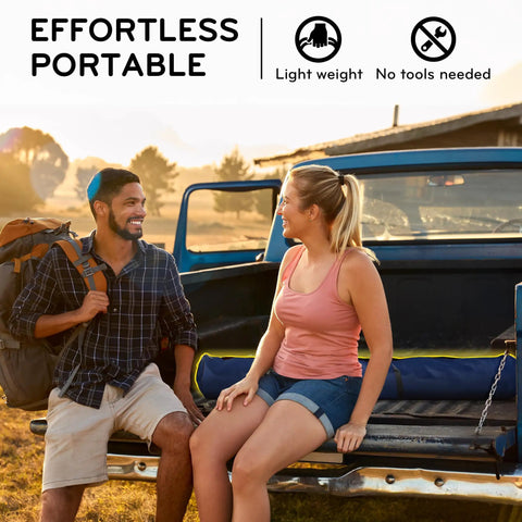 Two people sitting on a truck with a folded Hammock With Heavy Duty Steel Stand For Indoor And Outdoor Chill Sessions 600Lb Capacity.
